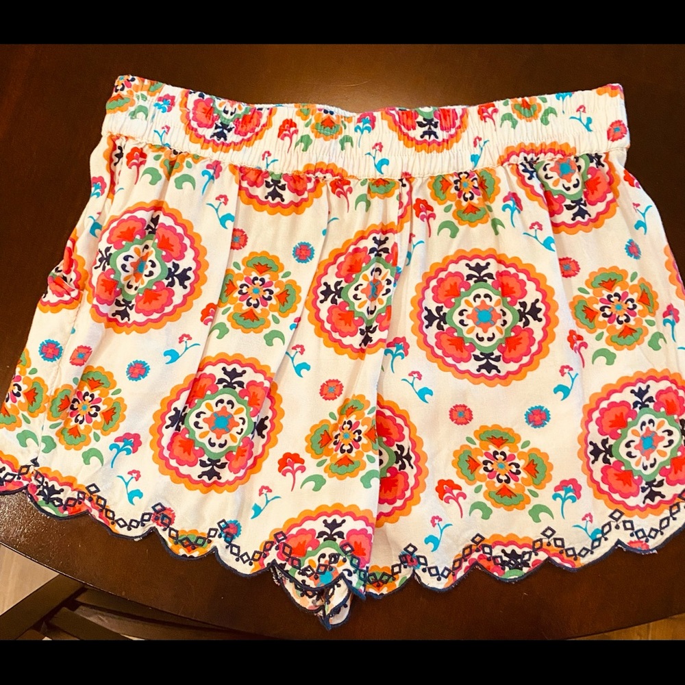 Khaki shorts size 6 and stretch colorful size medium. Both sold together for $20